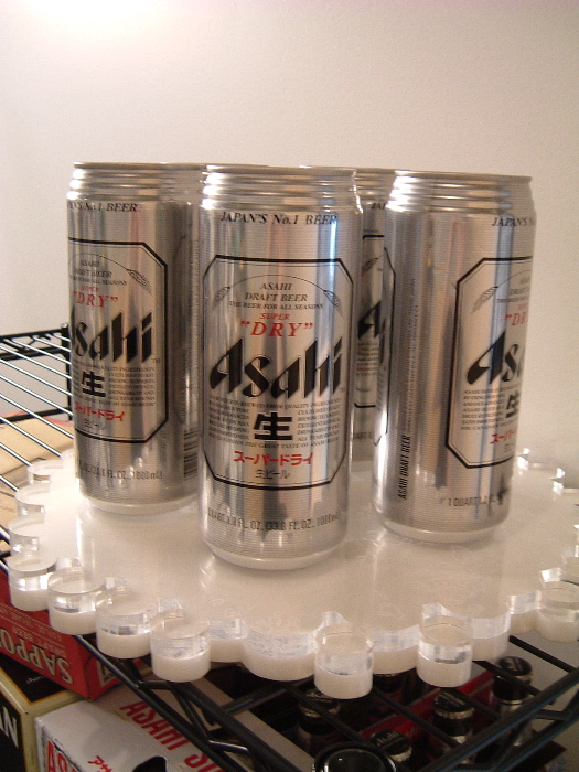 Really big cans of Asahi beer.